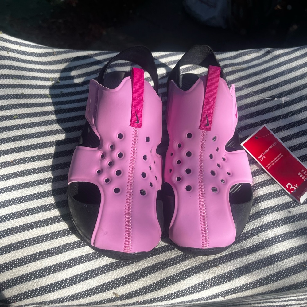 Nike Pink and Black Sandals with Comfort and Style